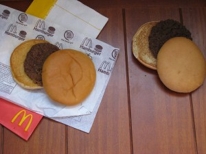 A photo of two McDonald's burgers, one 14 years old and looks new